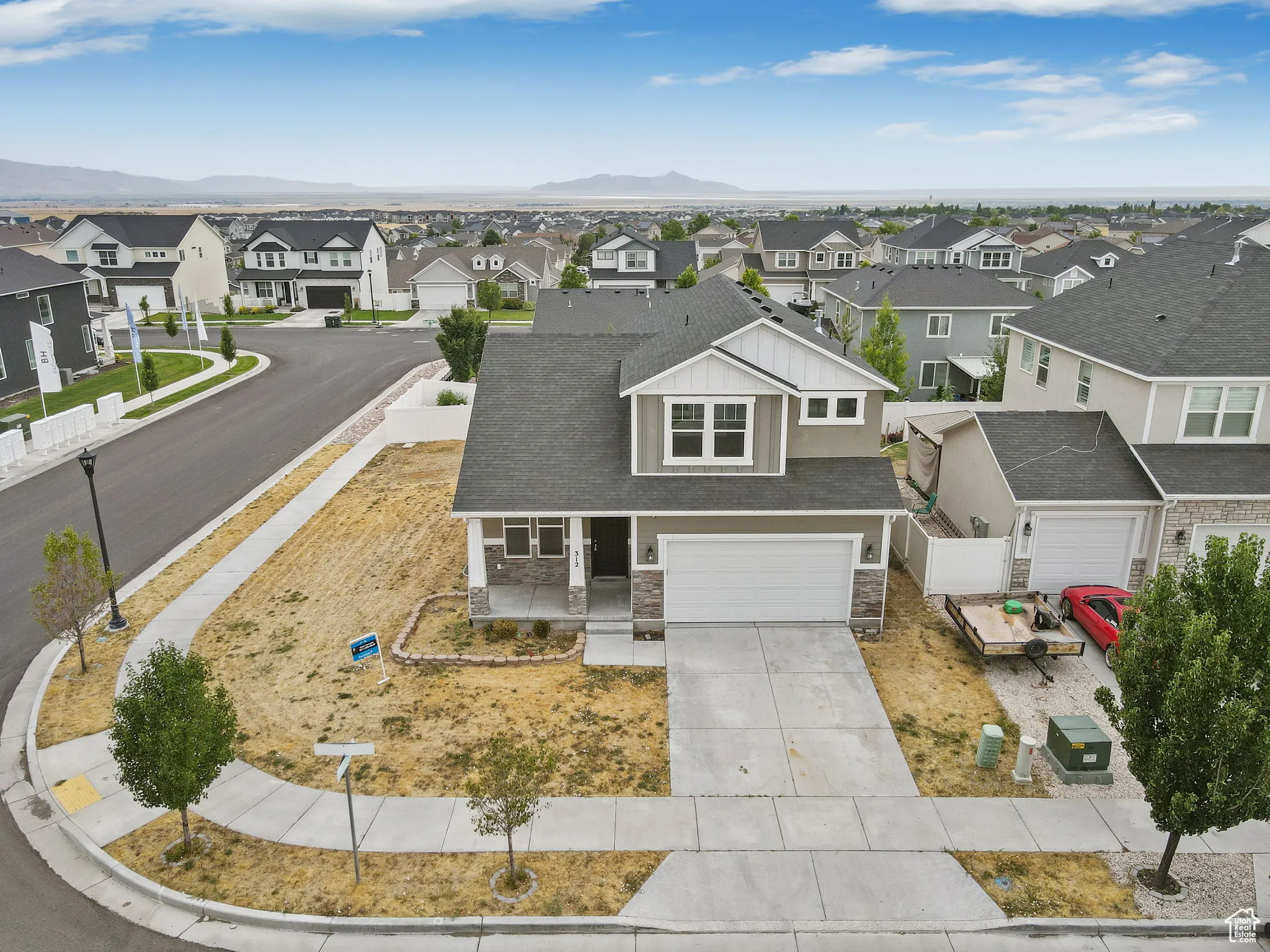 Aerial view of residential area featuring mountains