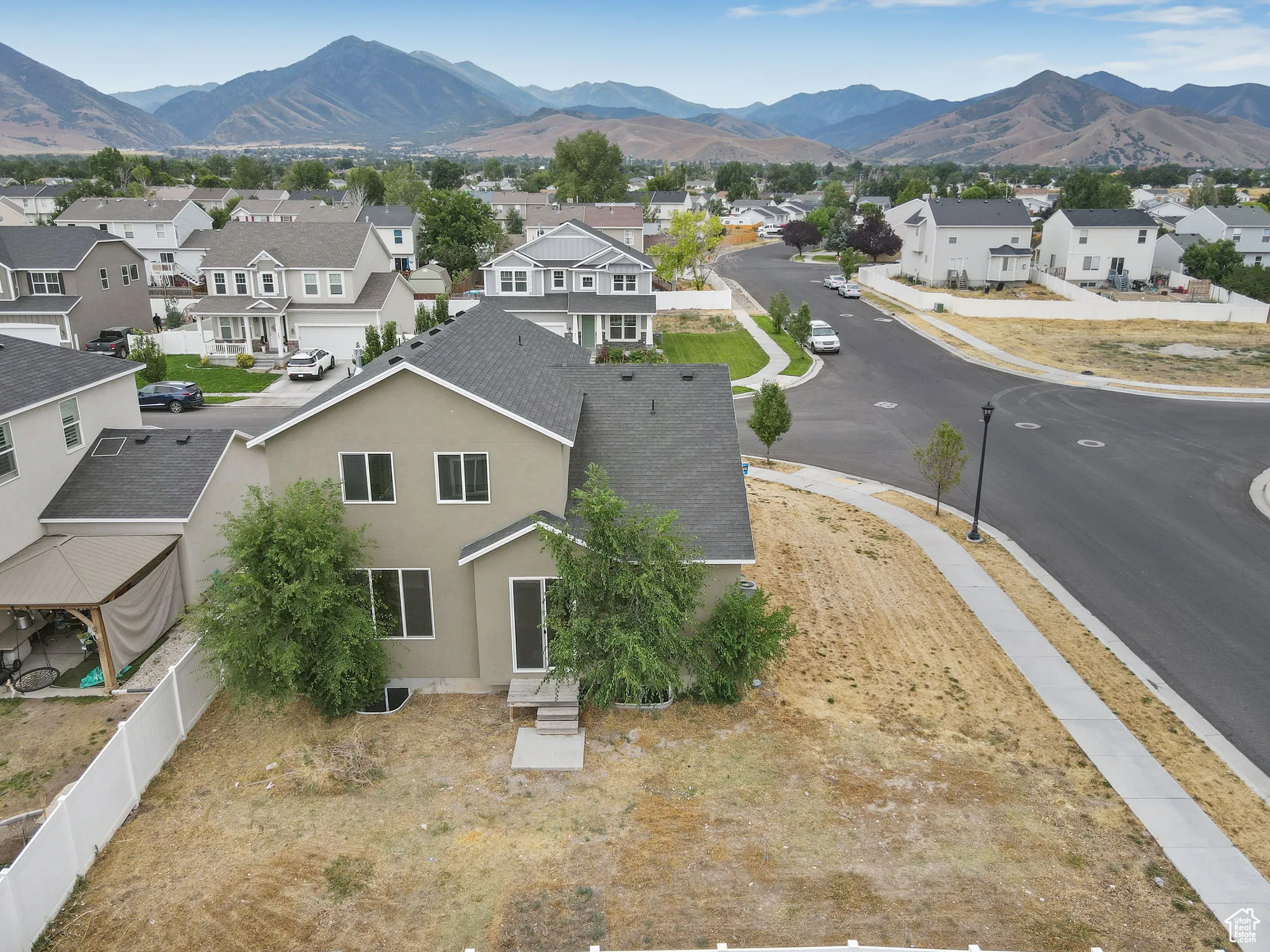 Aerial view of residential area with a mountainous background