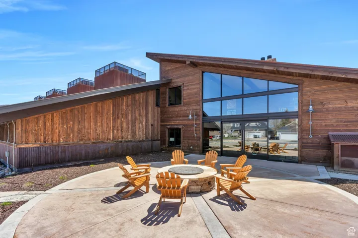 Back of house with a patio