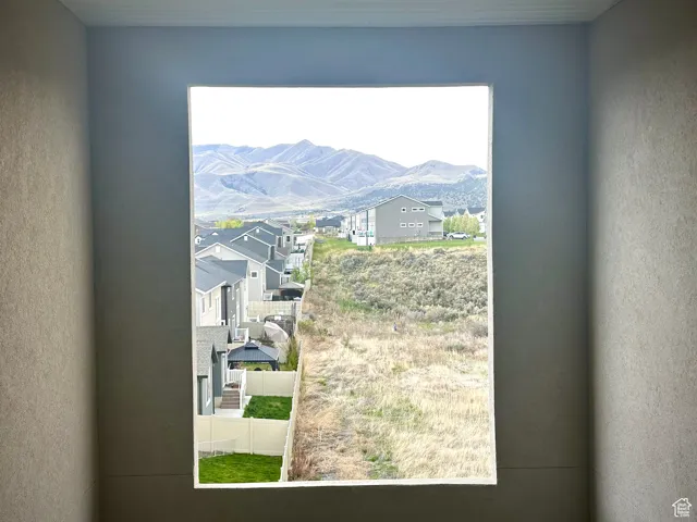 Room details featuring a mountain view and a residential view