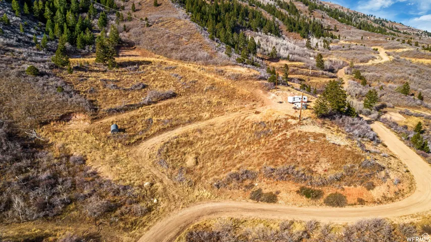 Birds eye view of property featuring a mountain view and a rural view