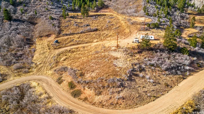 Birds eye view of property featuring view of desert and a rural view