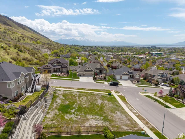 Drone / aerial view with a residential view and a mountain view