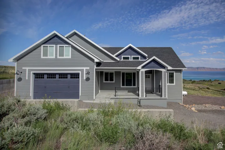 Craftsman house with covered porch and a garage
