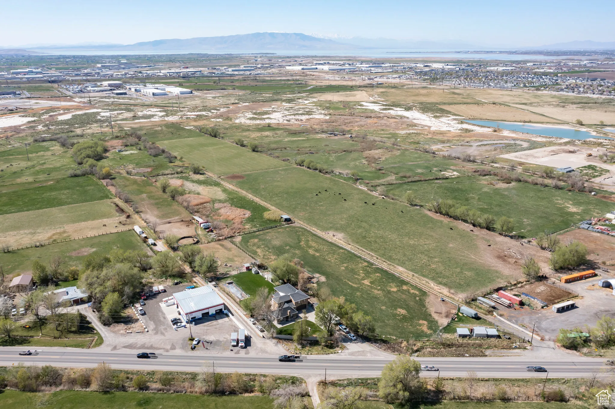 Drone / aerial view featuring a water and mountain view