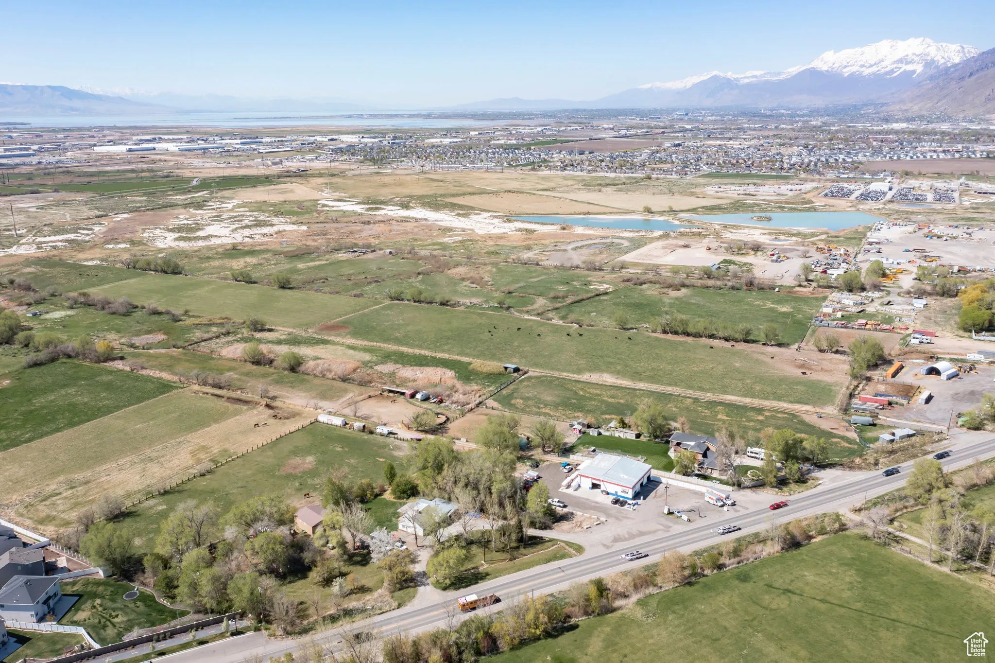 Drone / aerial view featuring a water and mountain view
