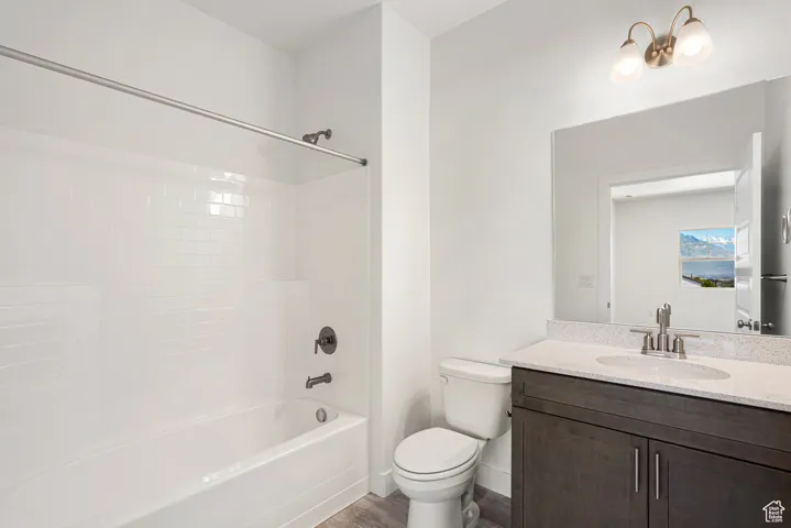 Full bath featuring vanity and bathtub / shower combination