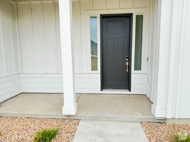 Entrance to property with a porch