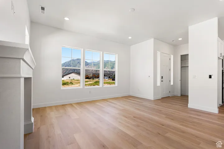 Unfurnished bedroom featuring light wood-style floors and recessed lighting