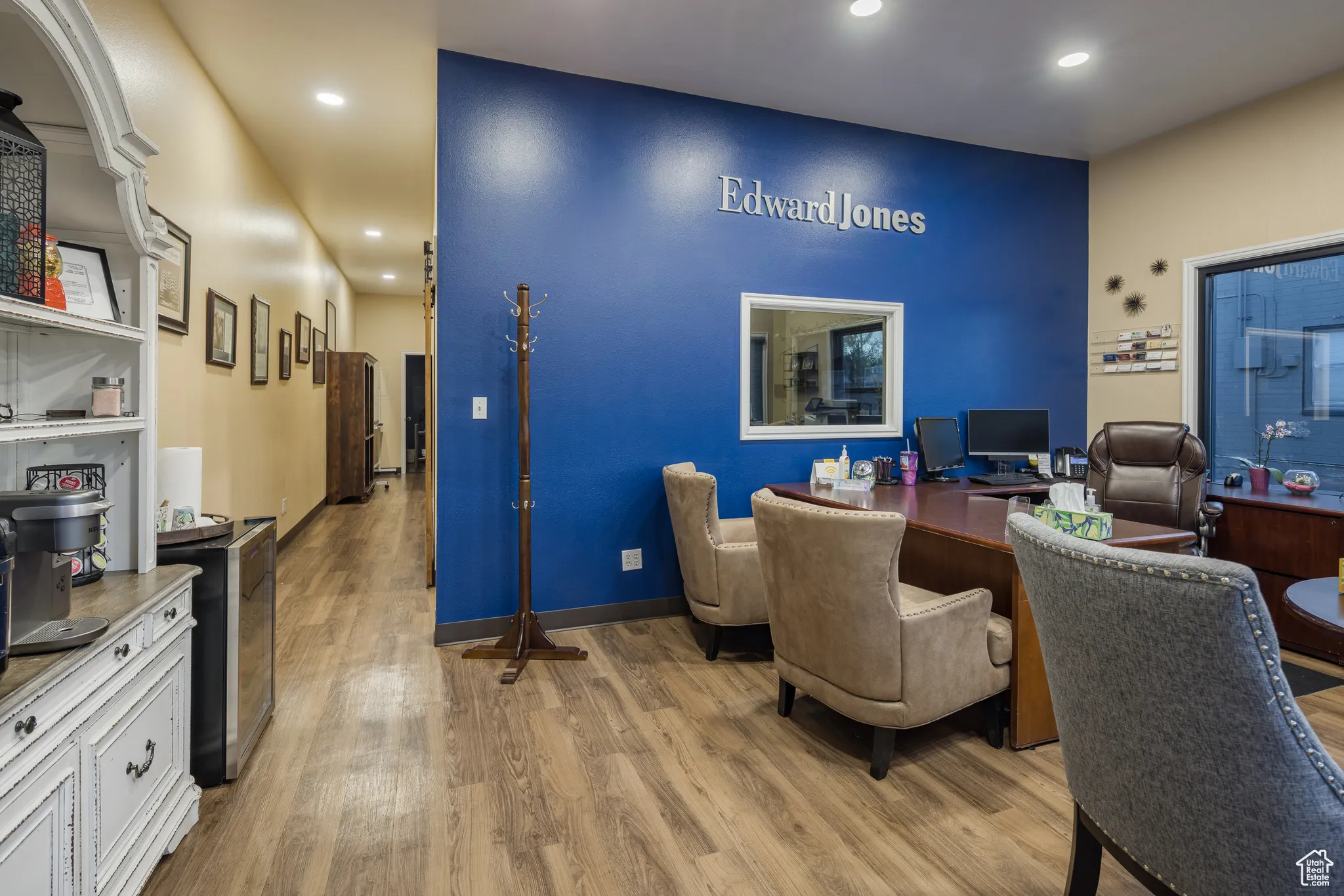 Office area featuring light wood finished floors and recessed lighting