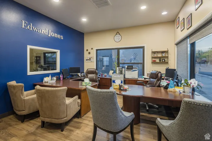 Office space featuring wood finished floors, visible vents, and recessed lighting
