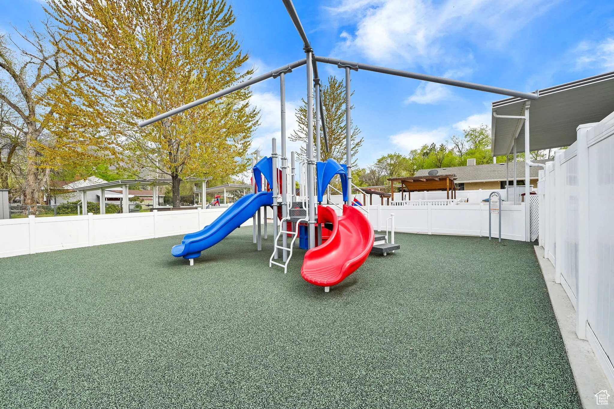 Communal playground featuring fence