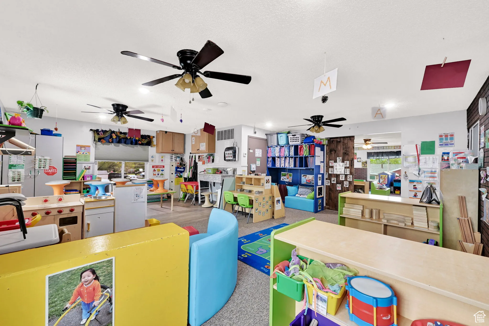 Game room featuring ceiling fan and visible vents