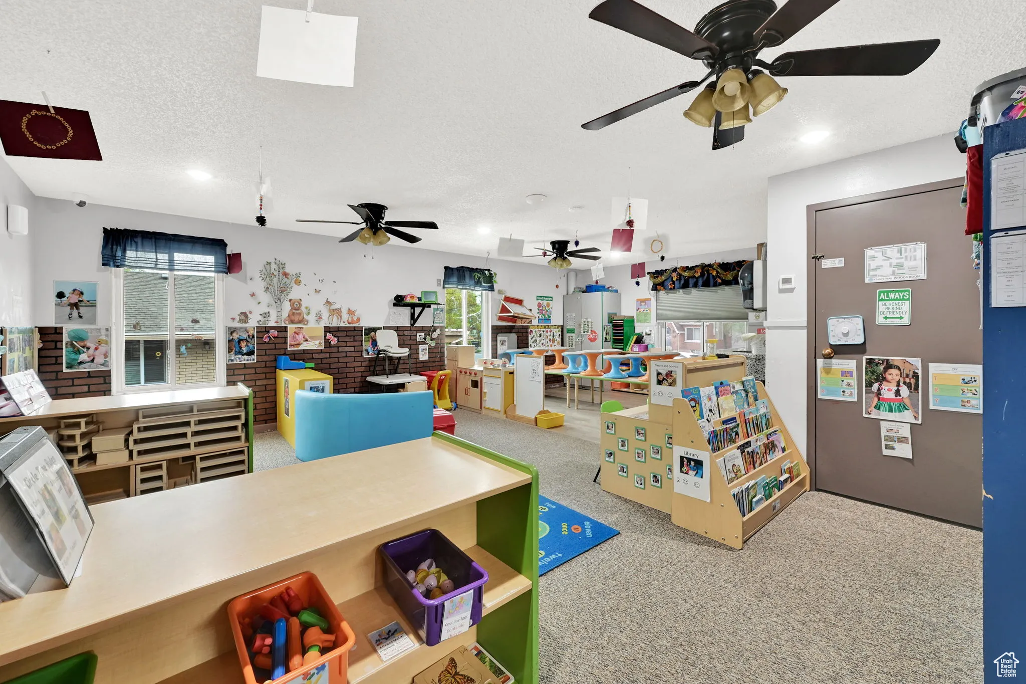 Rec room with a textured ceiling, a ceiling fan, recessed lighting, and carpet floors