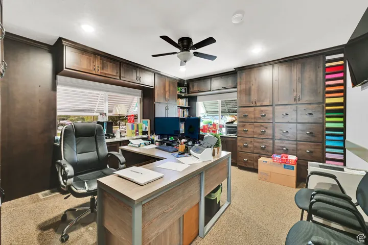 Office space with recessed lighting, light carpet, and ceiling fan