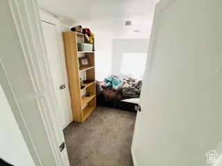 Corridor featuring carpet
