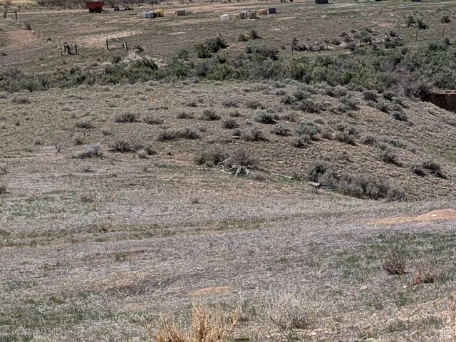 Property view of mountains with a rural view