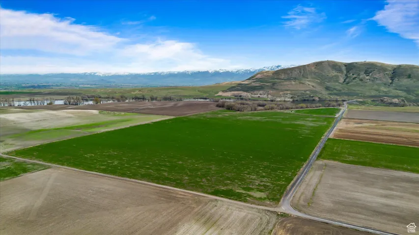 Property view of mountains featuring a water view