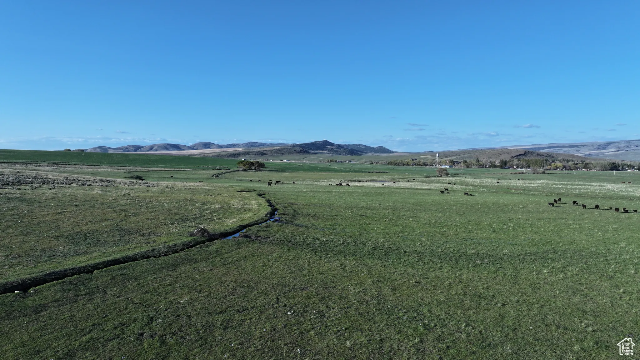 View of mountain background featuring rural landscape
