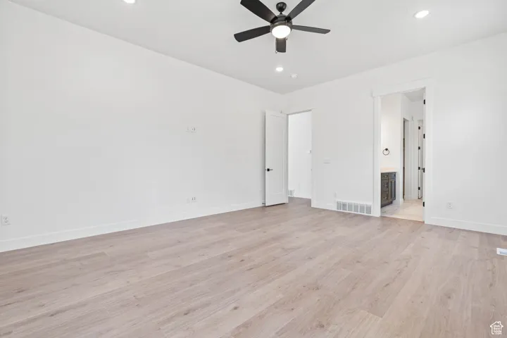 Unfurnished bedroom featuring visible vents, recessed lighting, light wood-style flooring, and baseboards