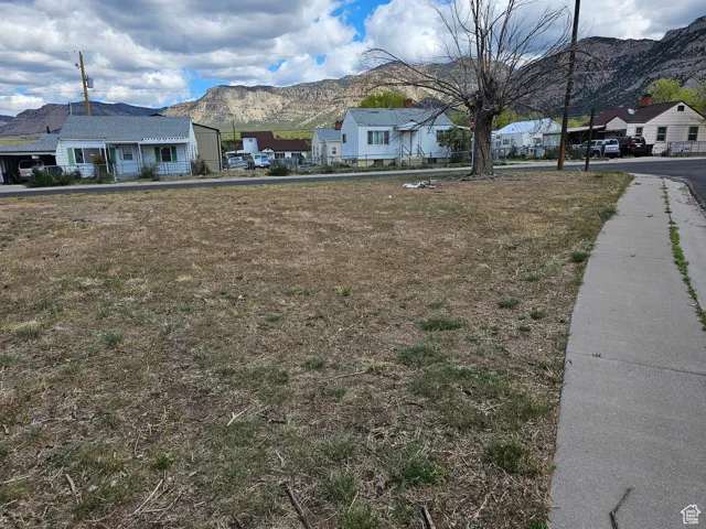 Single story home with a mountain view and a residential view