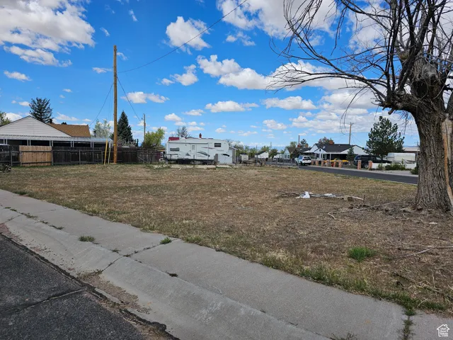 View of yard featuring fence