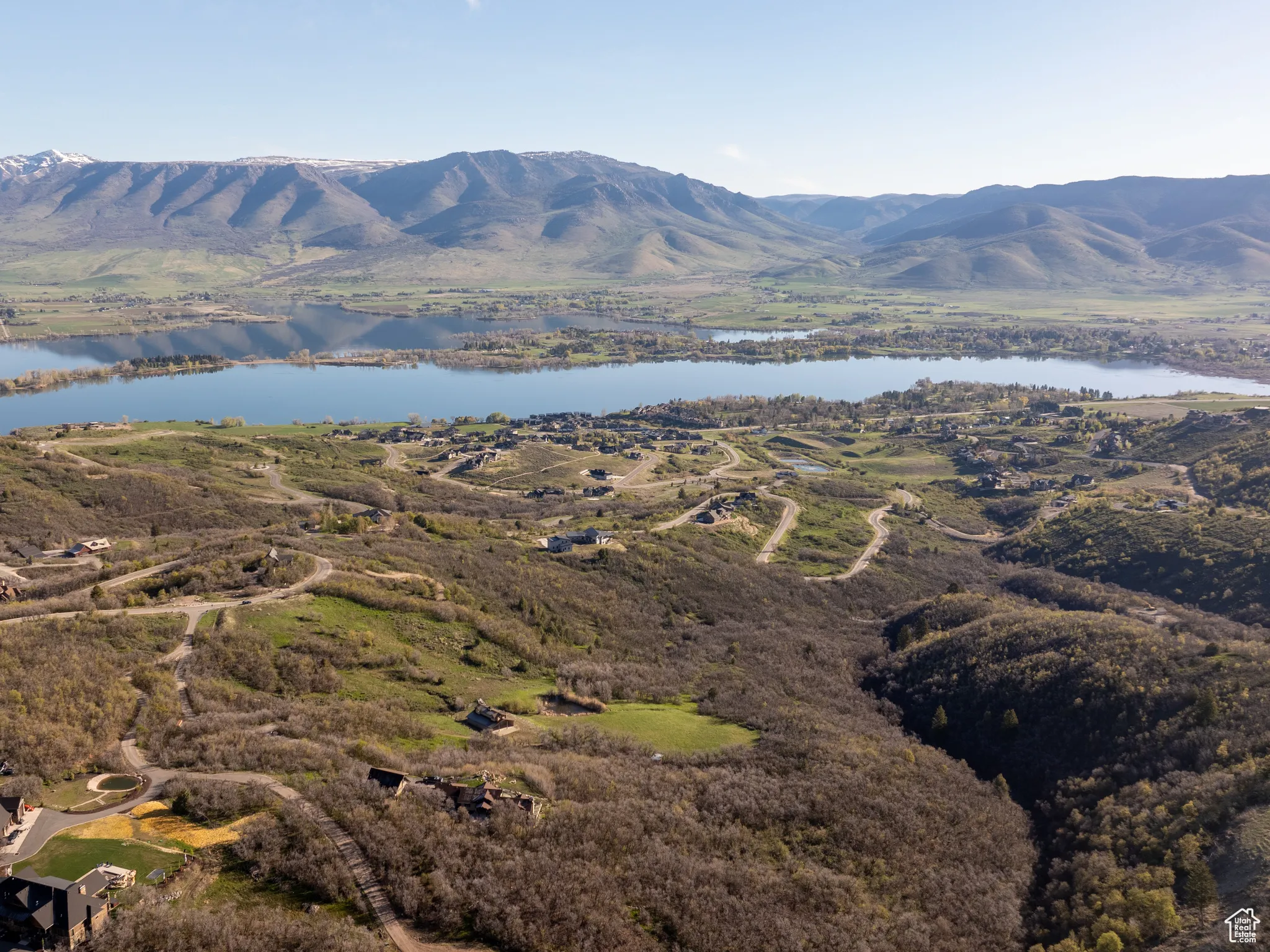 Property view of mountains with a water view