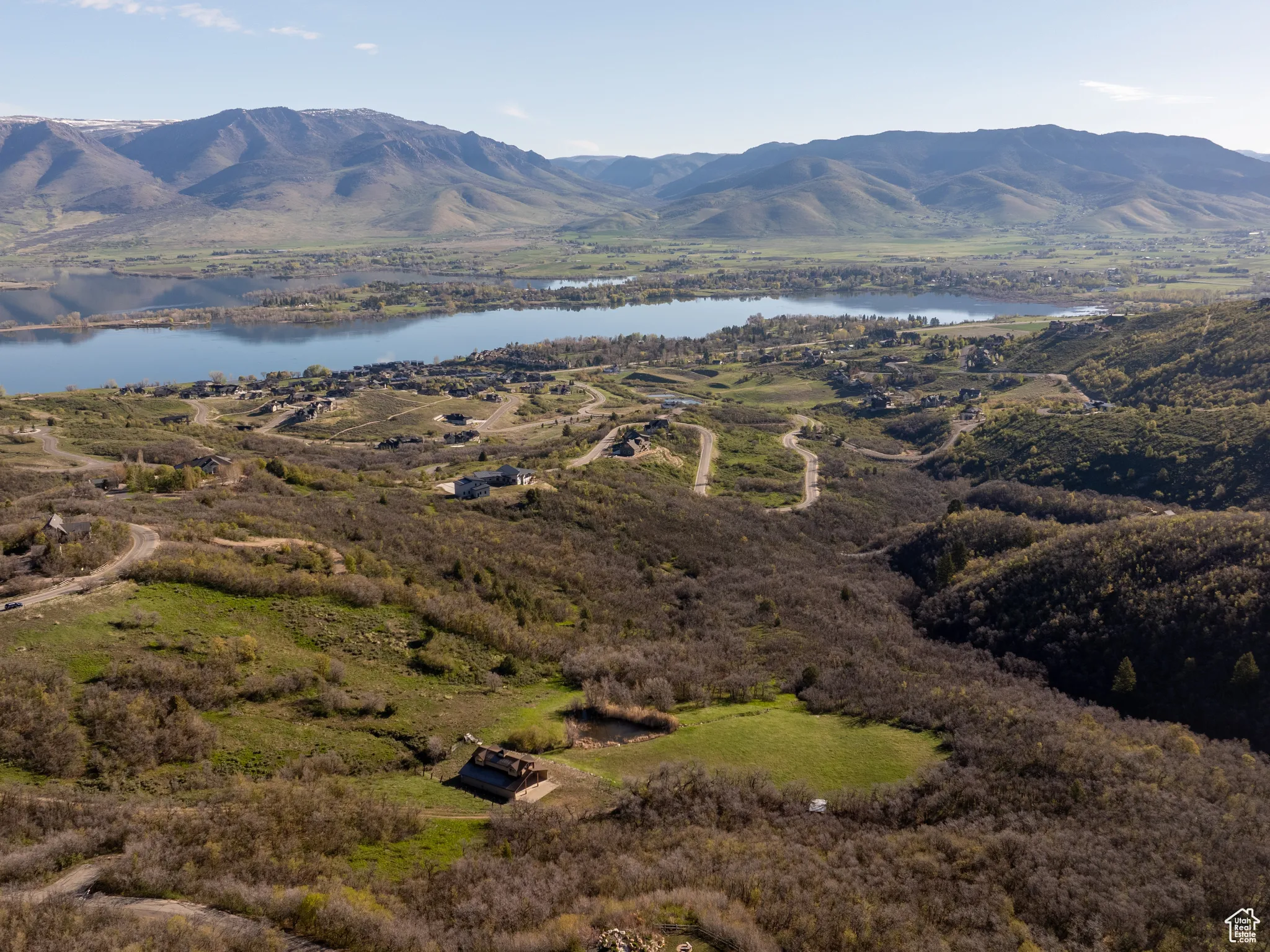 Property view of mountains featuring a water view