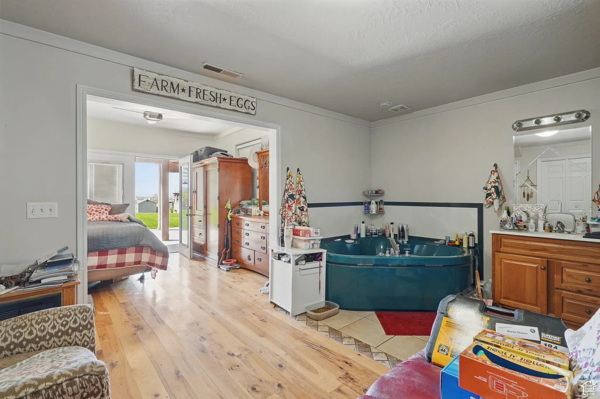 Miscellaneous room with visible vents and light wood-type flooring