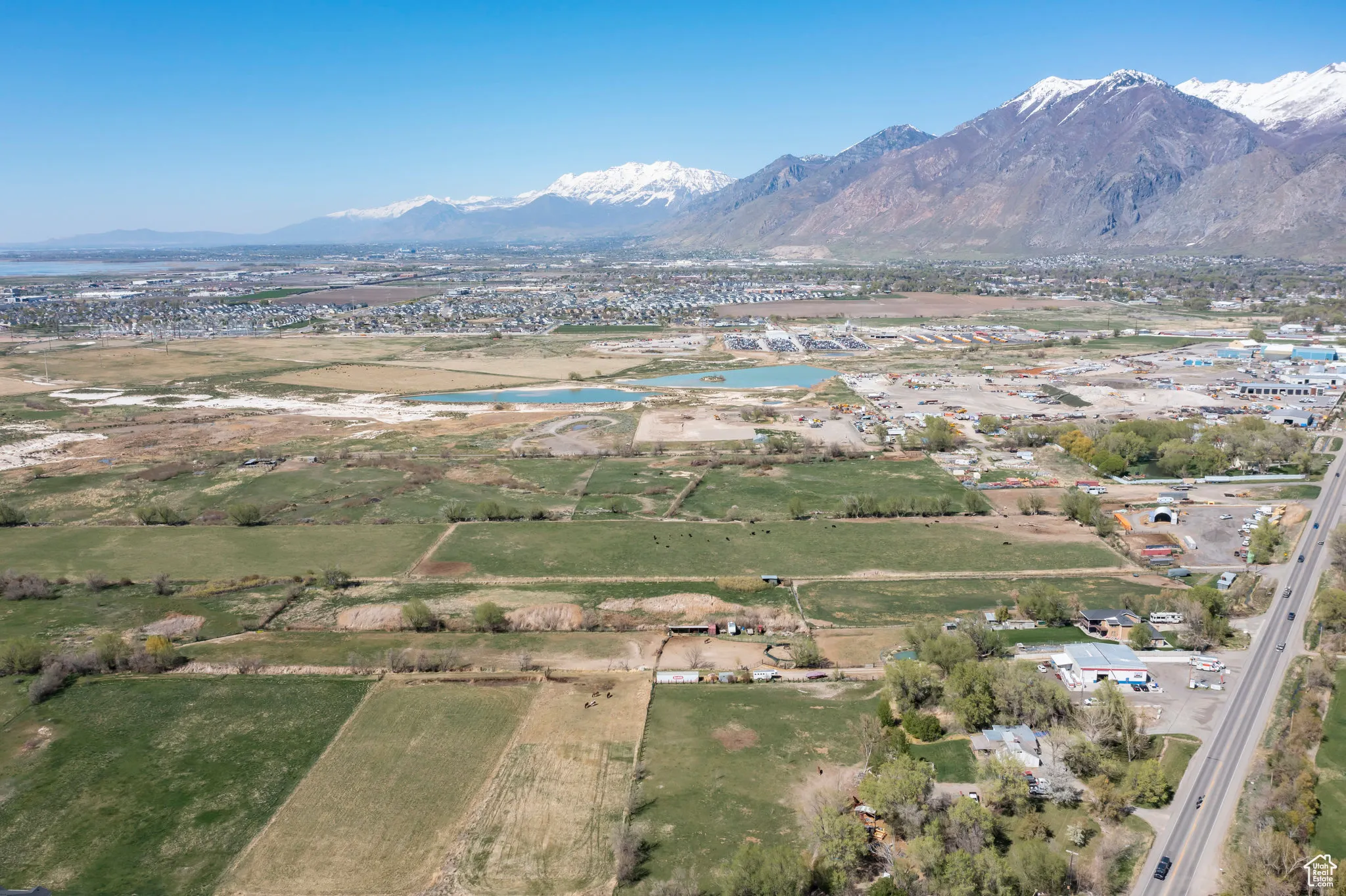 Drone / aerial view with a water and mountain view