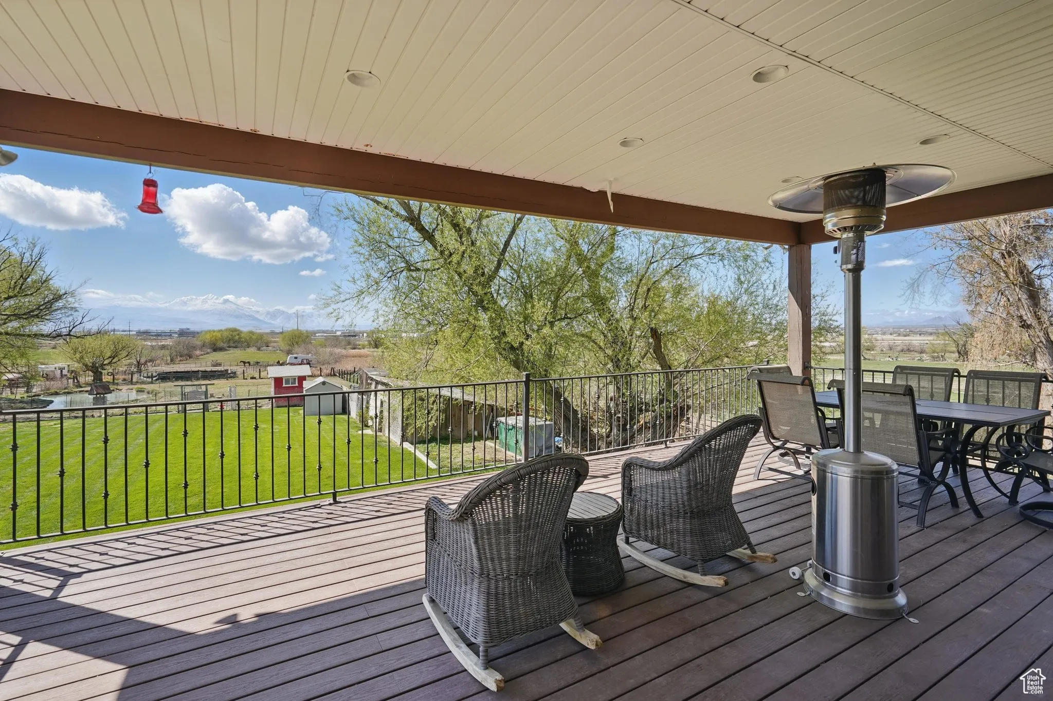 Wooden deck featuring a yard and outdoor dining space