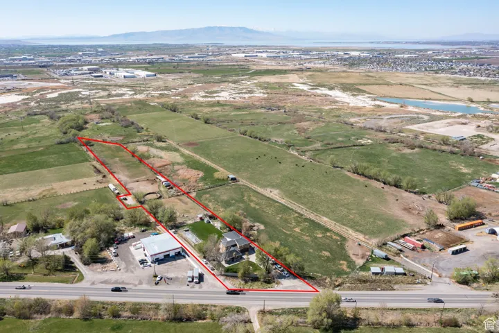 Aerial view featuring a rural view and a water and mountain view