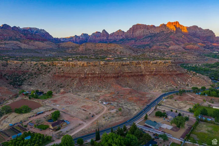 Aerial view at dusk of a mountain view and a view of countryside