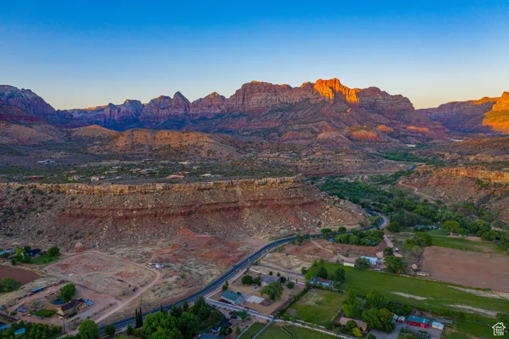 Aerial view of property's location with mountains and rural landscape