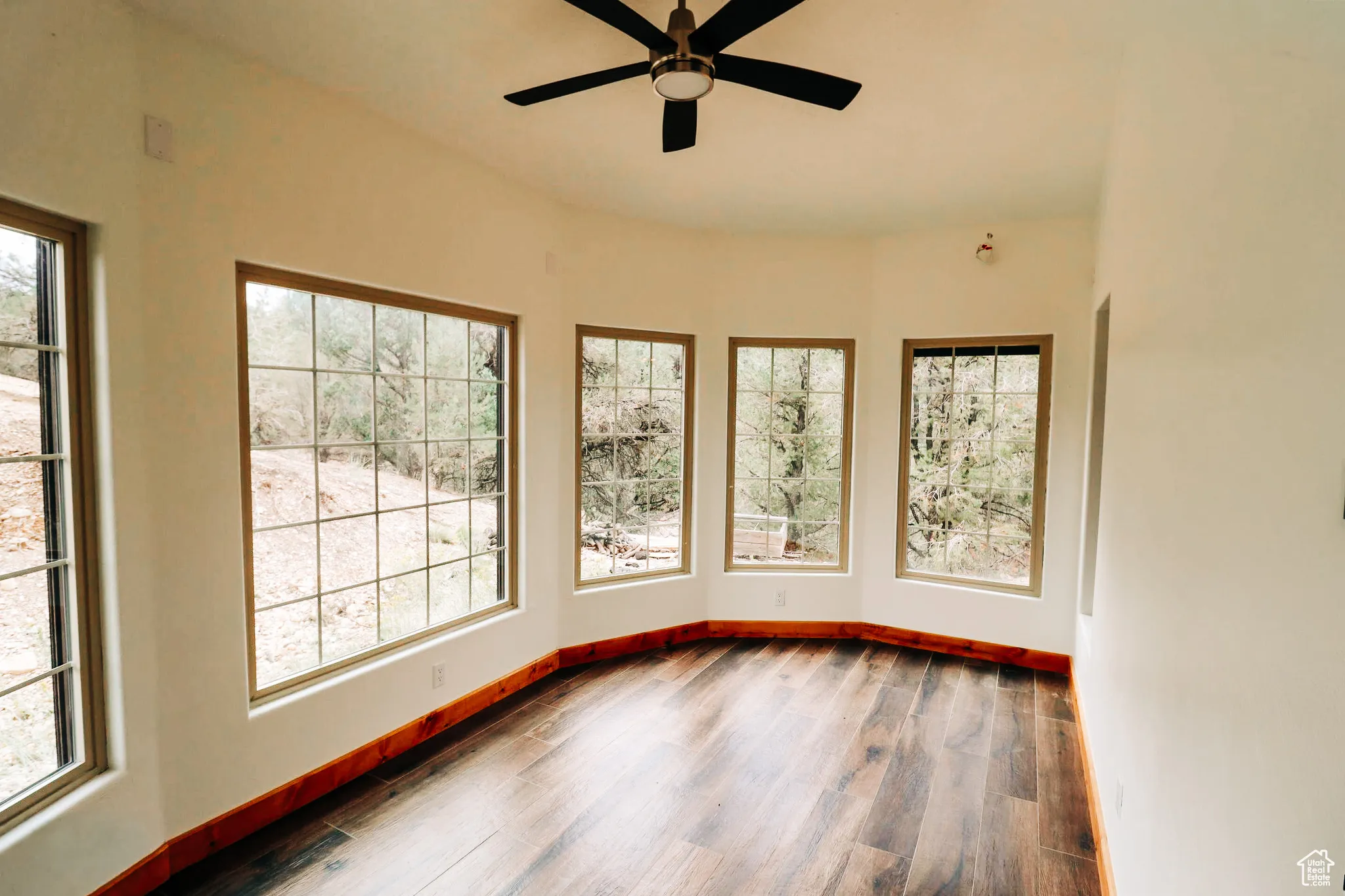 Unfurnished sunroom featuring healthy amount of natural light