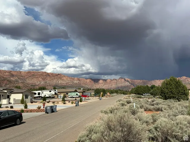 View of road featuring a residential view and a mountain view