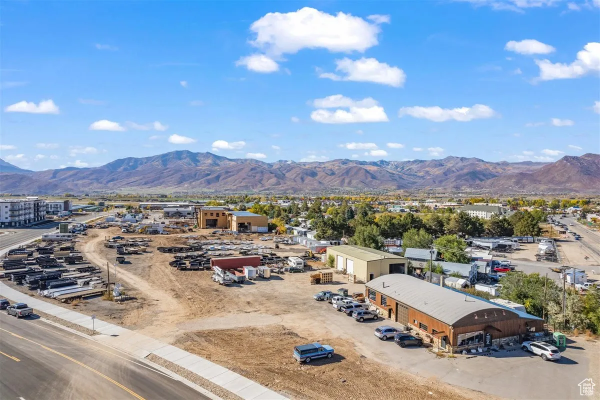 Birds eye view of property with a mountain view
