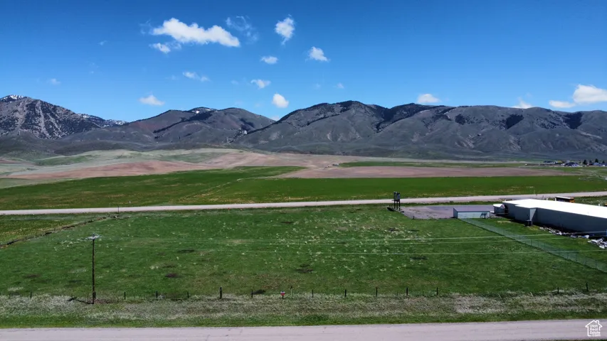 View of mountain background featuring rural landscape