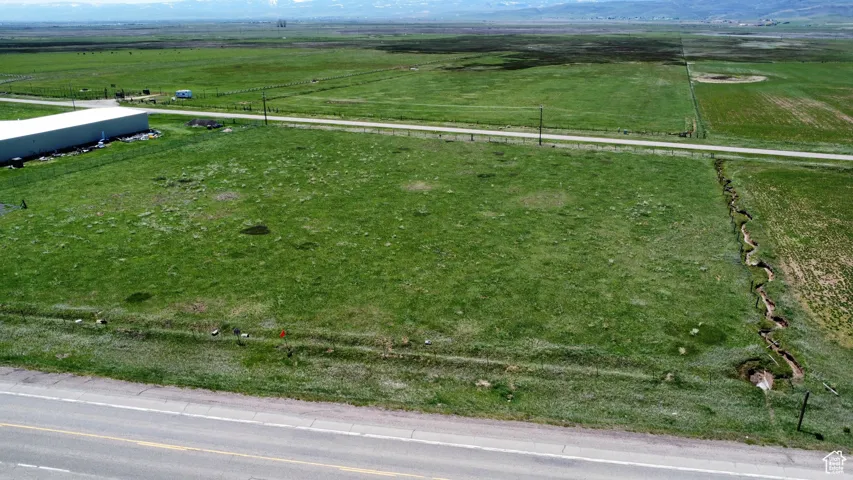 Overview of rural landscape featuring agricultural land and mountains