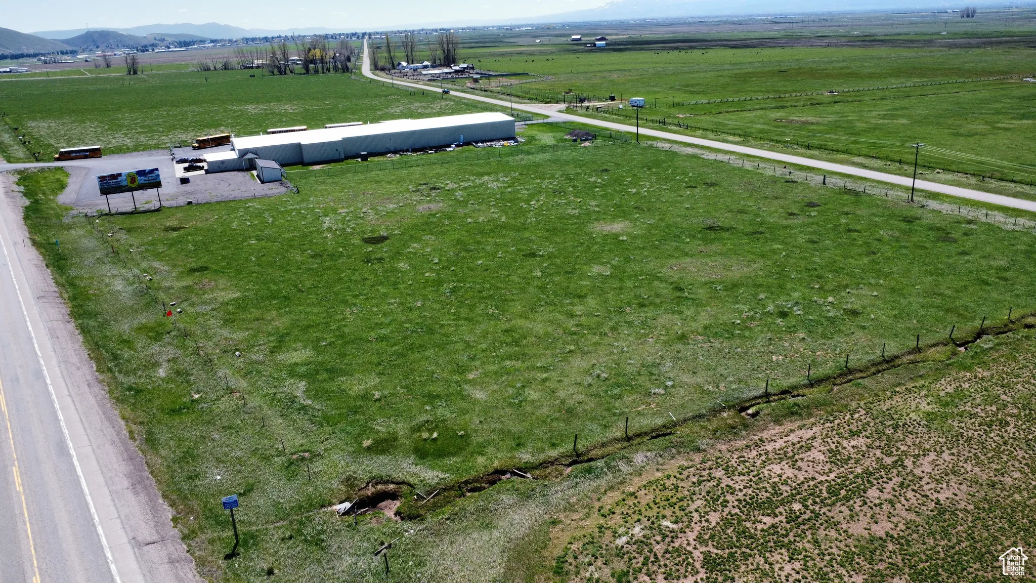 Overview of rural landscape featuring a mountainous background