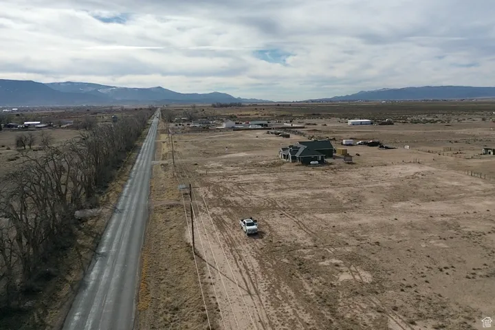 Drone / aerial view with a mountain view and a rural view