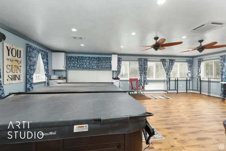 Playroom featuring ornamental molding, a ceiling fan, light wood-style floors, and recessed lighting