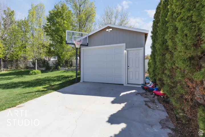 Detached garage featuring driveway