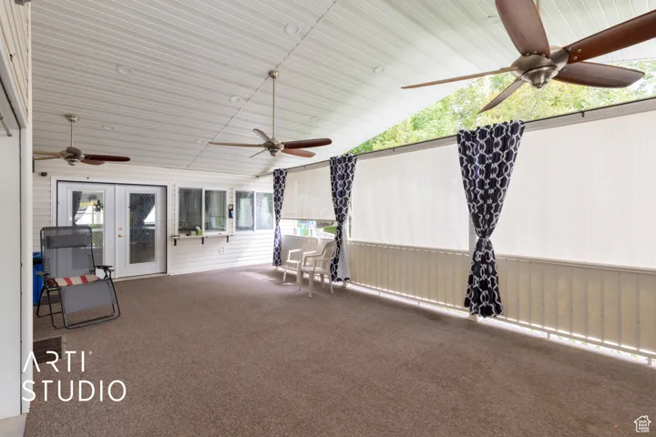 View of patio with ceiling fan