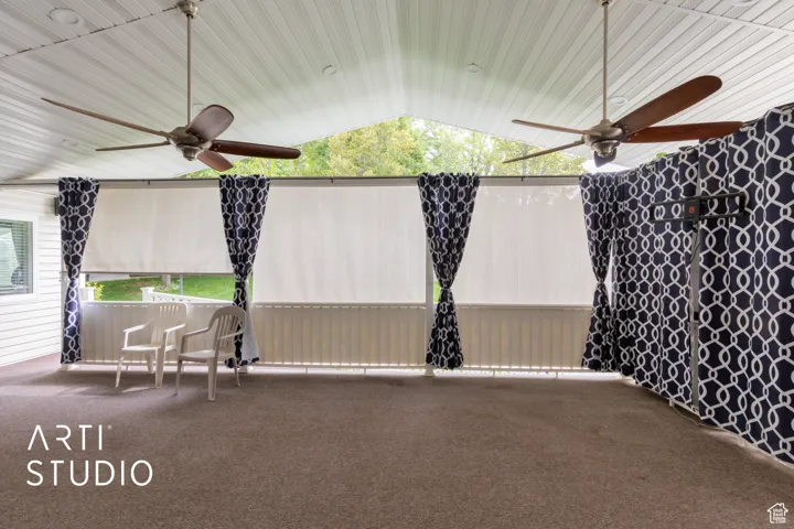 View of patio with a ceiling fan