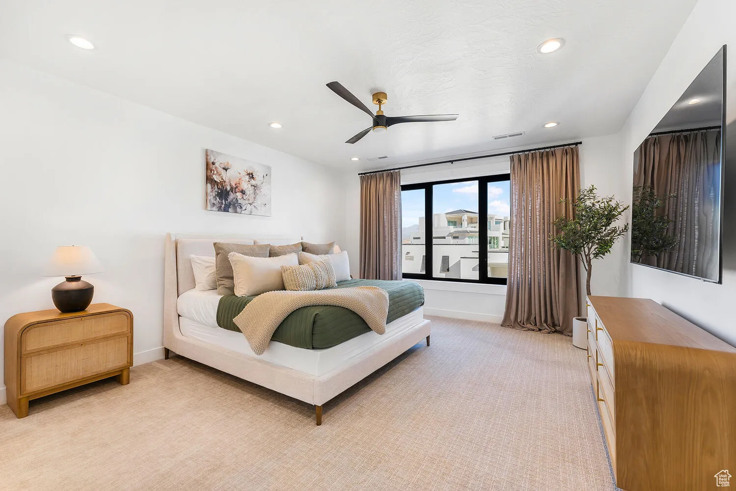 Bedroom with light carpet, recessed lighting, baseboards, and ceiling fan
