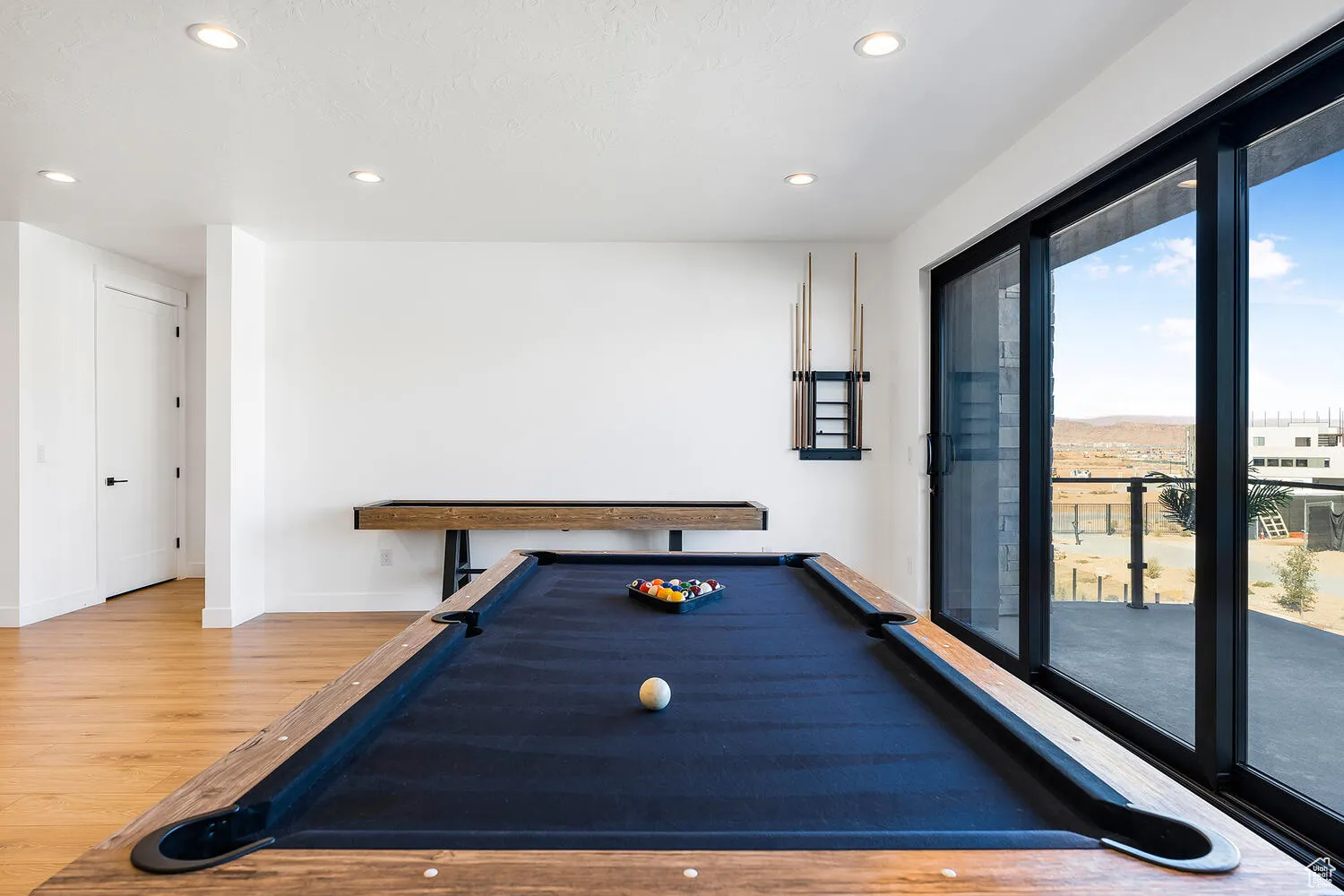 Recreation room featuring wood finished floors, recessed lighting, billiards, and baseboards
