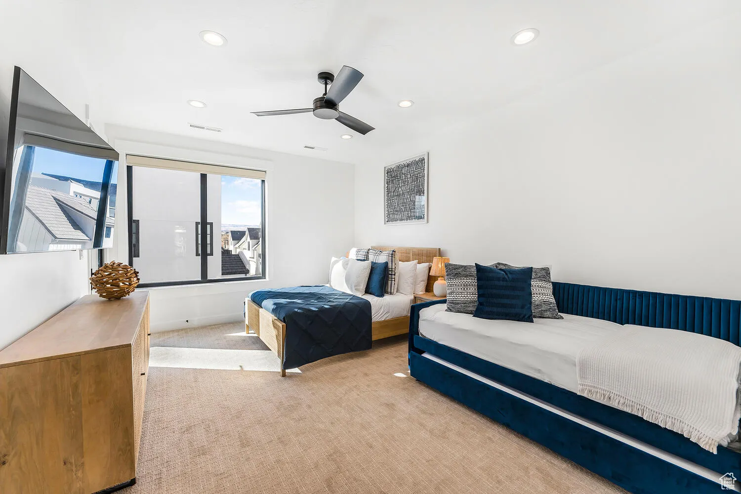 Carpeted bedroom with recessed lighting and a ceiling fan