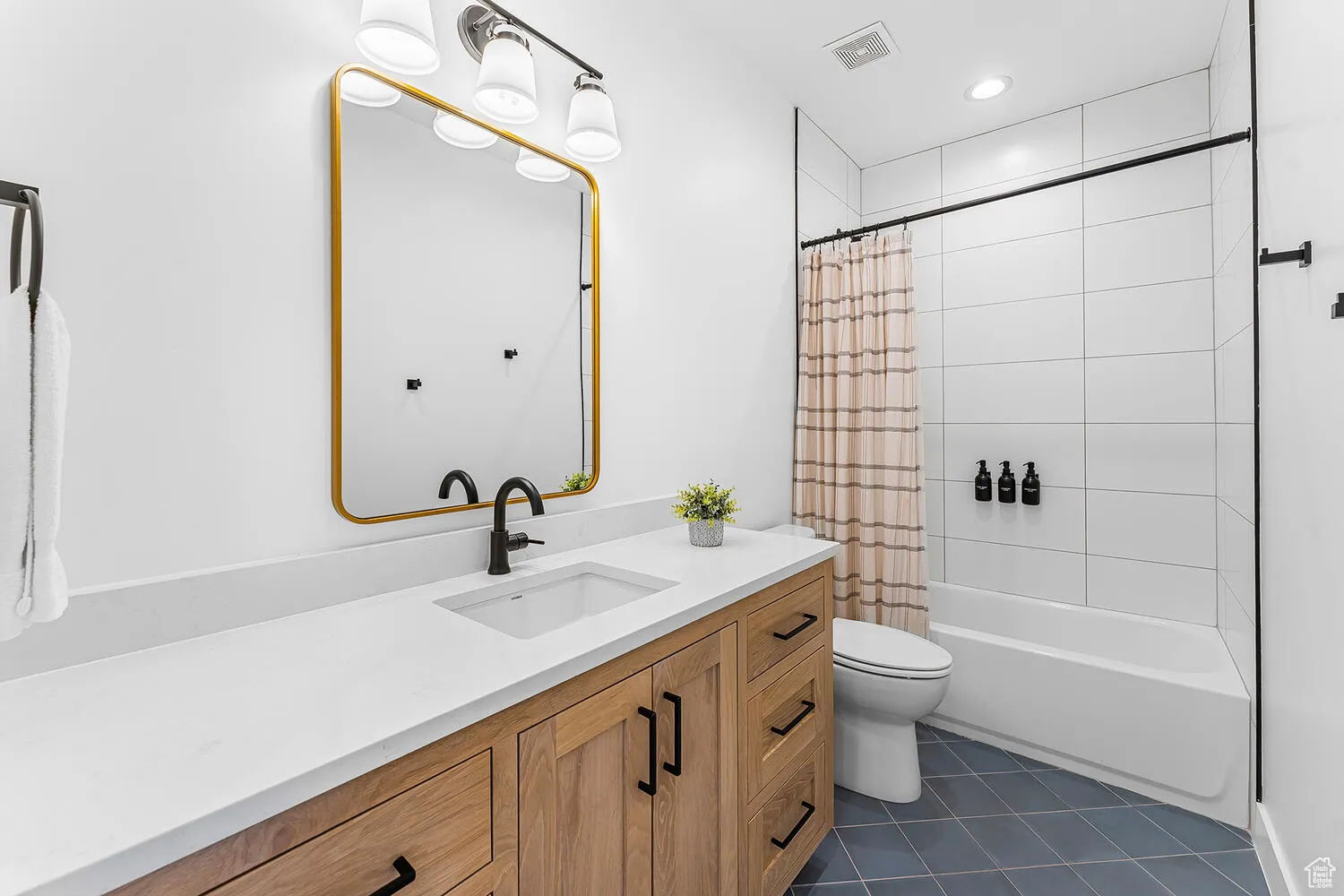 Full bathroom featuring toilet, tile patterned floors, vanity, shower / bathtub combination with curtain, and recessed lighting
