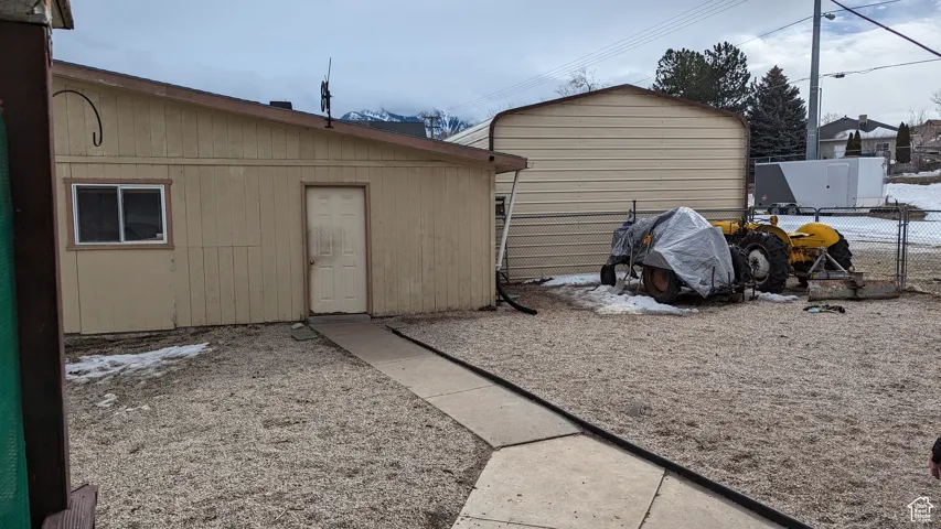 View of outdoor structure featuring an outdoor structure and fence